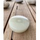 Grüner Onyx als Massagestein mit Atlantis-Symbol